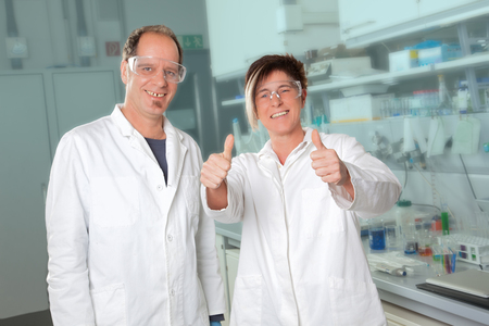 Two happy chemistsの写真素材