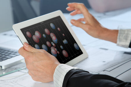 A Sales woman is analyzing a bubble chart の写真素材