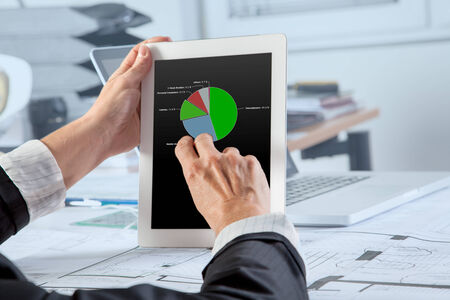 The Chief Financial Officer is analyzing the Revenue per Category on a mobile device の写真素材