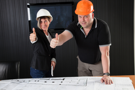 Two Architects are giving a thumbs up sign の写真素材