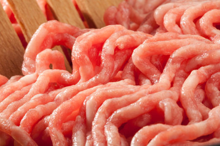 A very closeup view from a portion of minced meat in a pan の写真素材