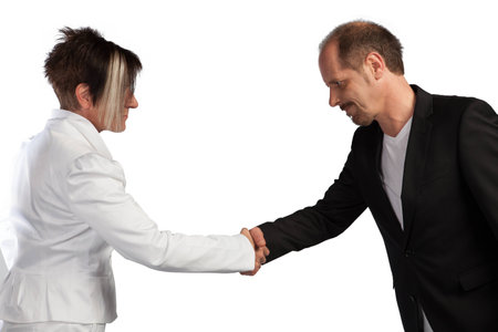 A Business Team are shaking there hands on a white background の写真素材