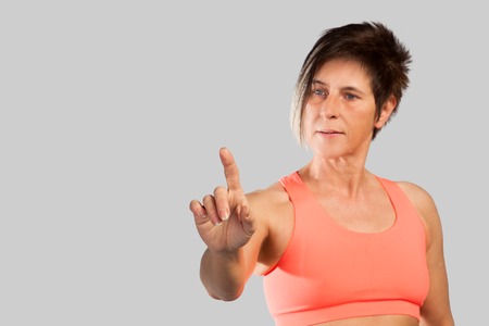 A woman is touching on a virtual screen の写真素材