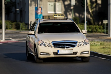 A german Taxi on a road in the city.のeditorial素材