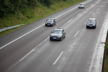 Some cars on a wet highway in Germany.の写真素材