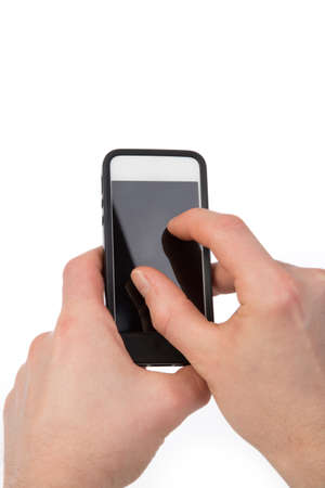 A man works with his phone and uses a phone gesture.の写真素材