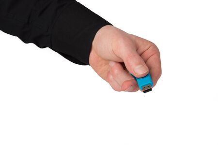 A Businessman is holding an blue USB Stick in his hands.の写真素材