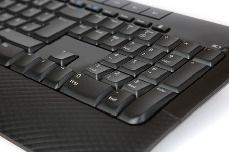 A part of a black Keyboard, isolated on a white background.