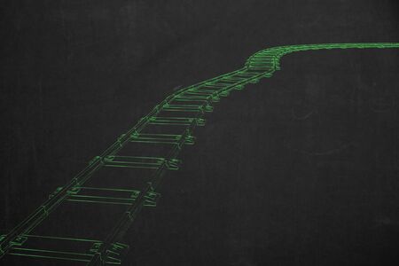 A train railway illustrated with green chalk on a dark chalkboard.の写真素材