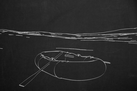 A chalk painting from a rubber boot on a dark chalkboard.の写真素材