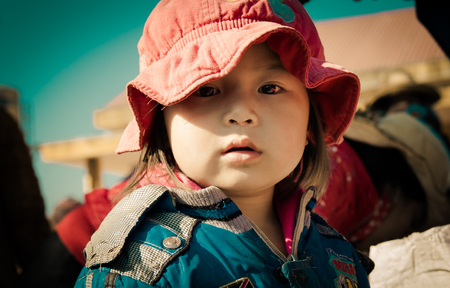 Lam Dong Province, Vietnam - January 24, 2015: The children's face before receiving gifts of ethnic minority children in the highlands. T?t c? gift for poor children come from a charity groupのeditorial素材