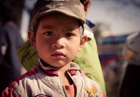 Lam Dong Province, Vietnam - January 24, 2015: The children's face before receiving gifts of ethnic minority children in the highlands. T?t c? gift for poor children come from a charity groupのeditorial素材