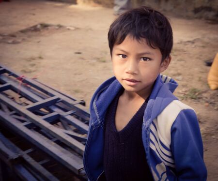 Lam Dong Province, Vietnam - January 24, 2015: The children's face before receiving gifts of ethnic minority children in the highlands. T?t c? gift for poor children come from a charity group.のeditorial素材