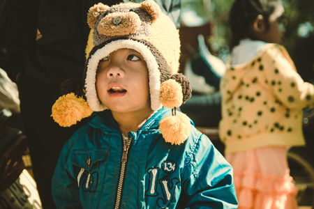 Lam Dong Province, Vietnam - January 24, 2015: The children's face before receiving gifts of ethnic minority children in the highlands. T?t c? gift for poor children come from a charity group.のeditorial素材