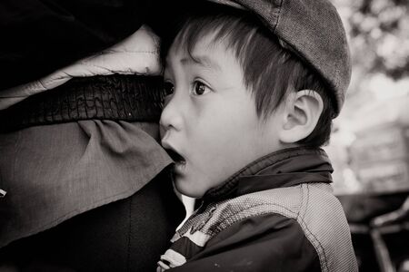 Lam Dong Province, Vietnam - January 24, 2015: The children's face before receiving gifts of ethnic minority children in the highlands. T?t c? gift for poor children come from a charity group.のeditorial素材