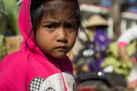 Lam Dong Province, Vietnam - January 24, 2015: The children's face before receiving gifts of ethnic minority children in the highlands. T?t c? gift for poor children come from a charity group.のeditorial素材