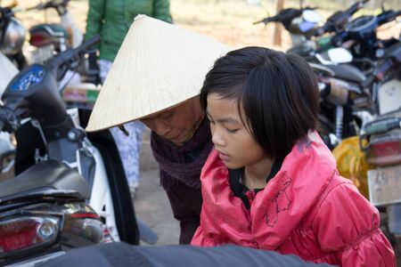 Lam Dong Province, Vietnam - January 24, 2015: The children's face before receiving gifts of ethnic minority children in the highlands. T?t c? gift for poor children come from a charity group.のeditorial素材