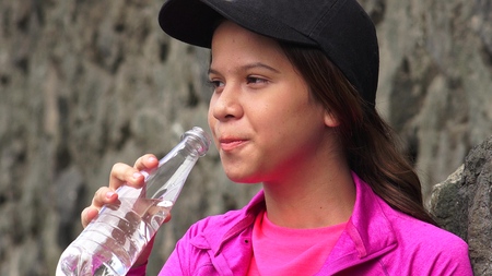Female Teen Drinking Bottled Waterの写真素材