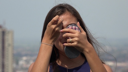 Teen Girl Applying Makeupの写真素材