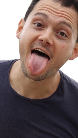 Funny Faces Man Sticking His Tongue Outの写真素材