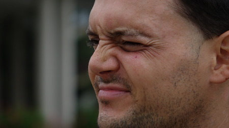 Unshaven Bearded Man Squinting