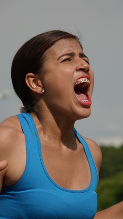 Minority Female Youngster Shoutingの写真素材