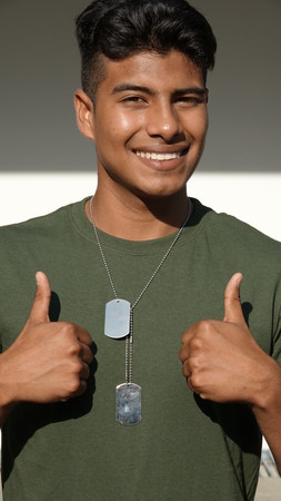 Handsome Male Soldier With Thumbs Upの写真素材
