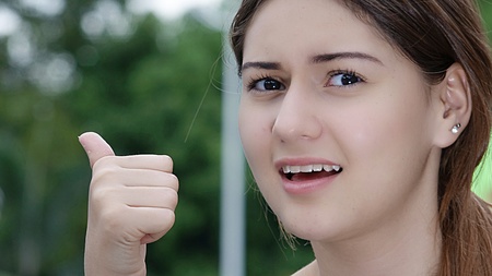 Teenager Female With Thumbs Upの写真素材