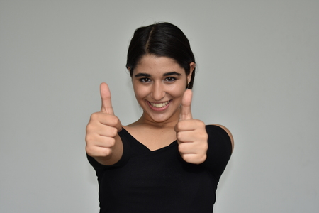 Pretty Girl Teenager With Thumbs Upの写真素材