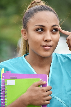Teen Hispanic Female Nursing Student Thinkingの写真素材