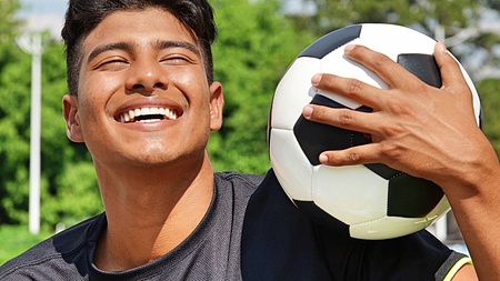 Sporty Male Soccer Player Laughingの写真素材