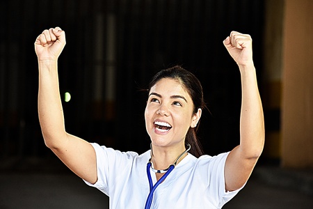 Happy Minority Person Wearing Scrubsの写真素材