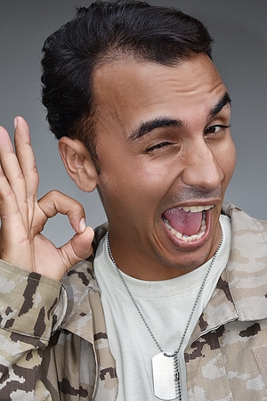 Colombian Male Soldier And Okay Signの写真素材