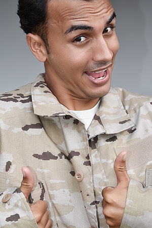 Diverse Male Soldier With Thumbs Upの写真素材