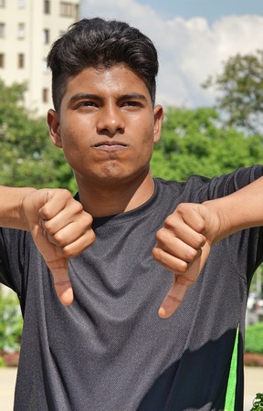 Latino Boy With Thumbs Down