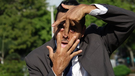 Business Man Making Funny Facesの写真素材