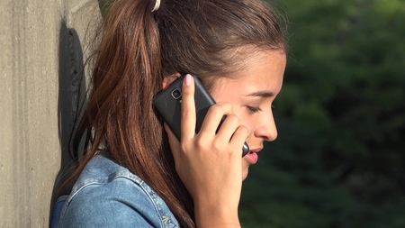 Teen Girl Talking On Cell Phoneの写真素材