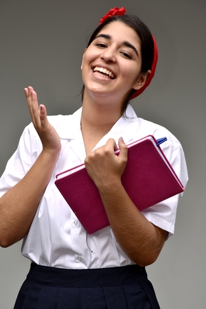 Happy Female Student Wearing Uniformの写真素材