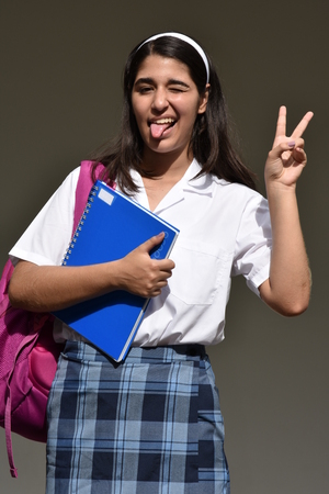Girl Student And Peace Sign Wearing School Uniformの写真素材