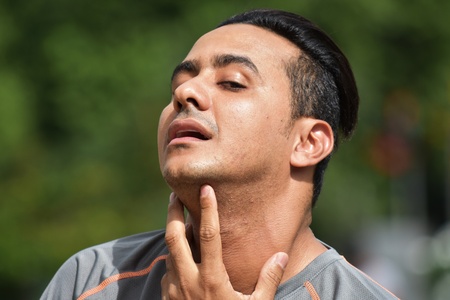 Adult Male Athlete With Sore Throatの写真素材