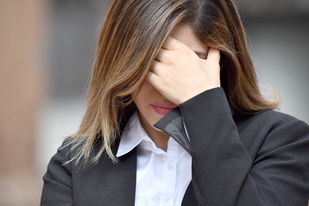 Depressed Adult Colombian Business Woman Wearing Suitの写真素材