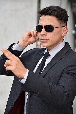 Young Colombian Security Guard Pointingの写真素材