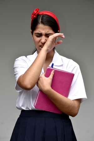 Crying Catholic Colombian School Girl With Notebookの写真素材