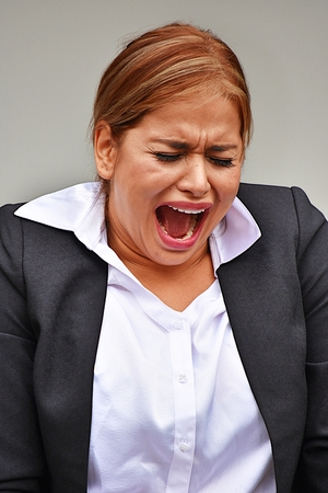 Upset Attractive Business Woman Wearing Suitの写真素材