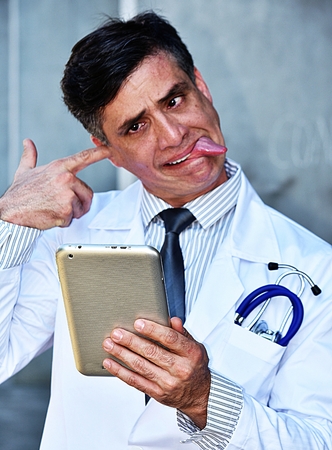 Insane Male Doctor With Tabletの写真素材