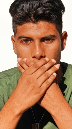 Ashamed Young Colombian Male Soldierの写真素材
