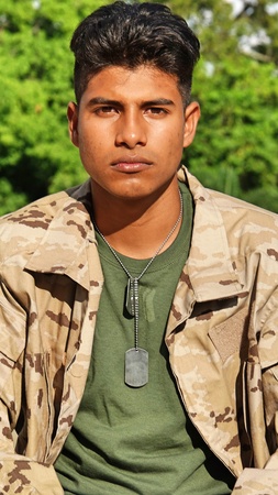 Unemotional Hispanic Male Soldierの写真素材