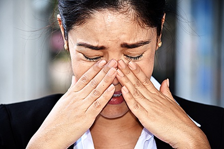Crying Colombian Business Woman Wearing Suitの写真素材