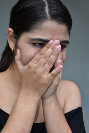 Ashamed Minority Teen Girlの写真素材