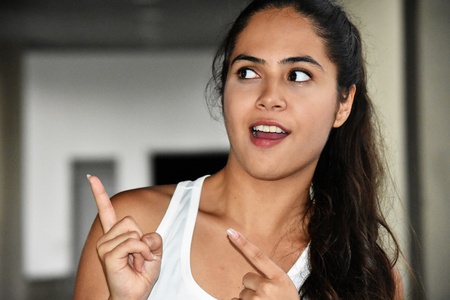 Cute Colombian Female Youngster Pointingの写真素材